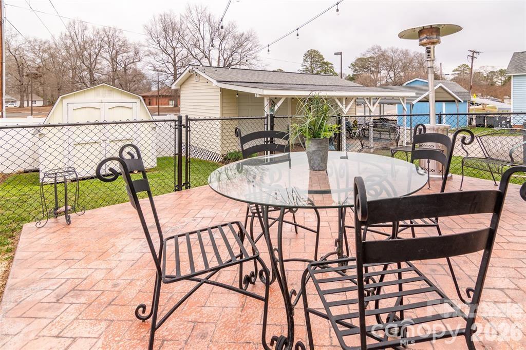 1004 Valley Street Kannapolis, NC 28081 - Photo 17 of 18 a view of a patio with a table and chairs