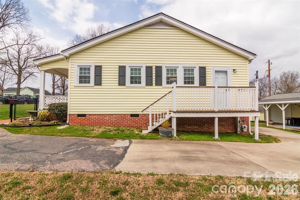1004 Valley Street Kannapolis, NC 28081 - Photo 18 of 18 a front view of a house with a yard and a garage