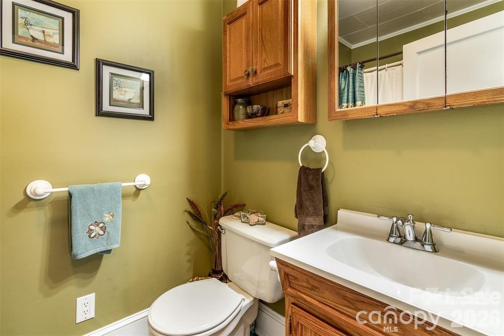 1004 Valley Street Kannapolis, NC 28081 - Photo 10 of 18 a bathroom with a sink and a toilet