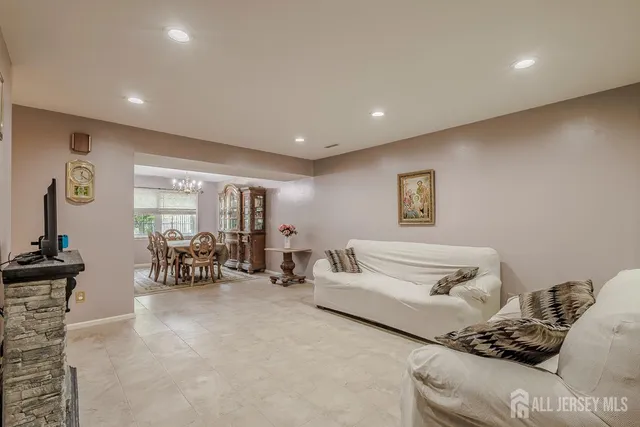 a living room with furniture and gym equipment