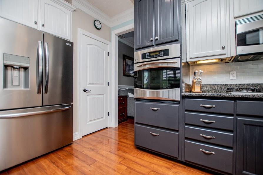 575 Liberty Church Road Carrollton, GA 30116 - Photo 17 of 95 a kitchen with stainless steel appliances granite countertop a refrigerator and a stove top oven