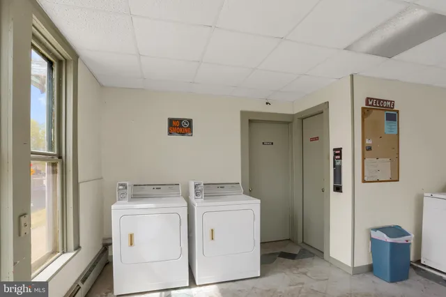 a utility room with dryer and washer