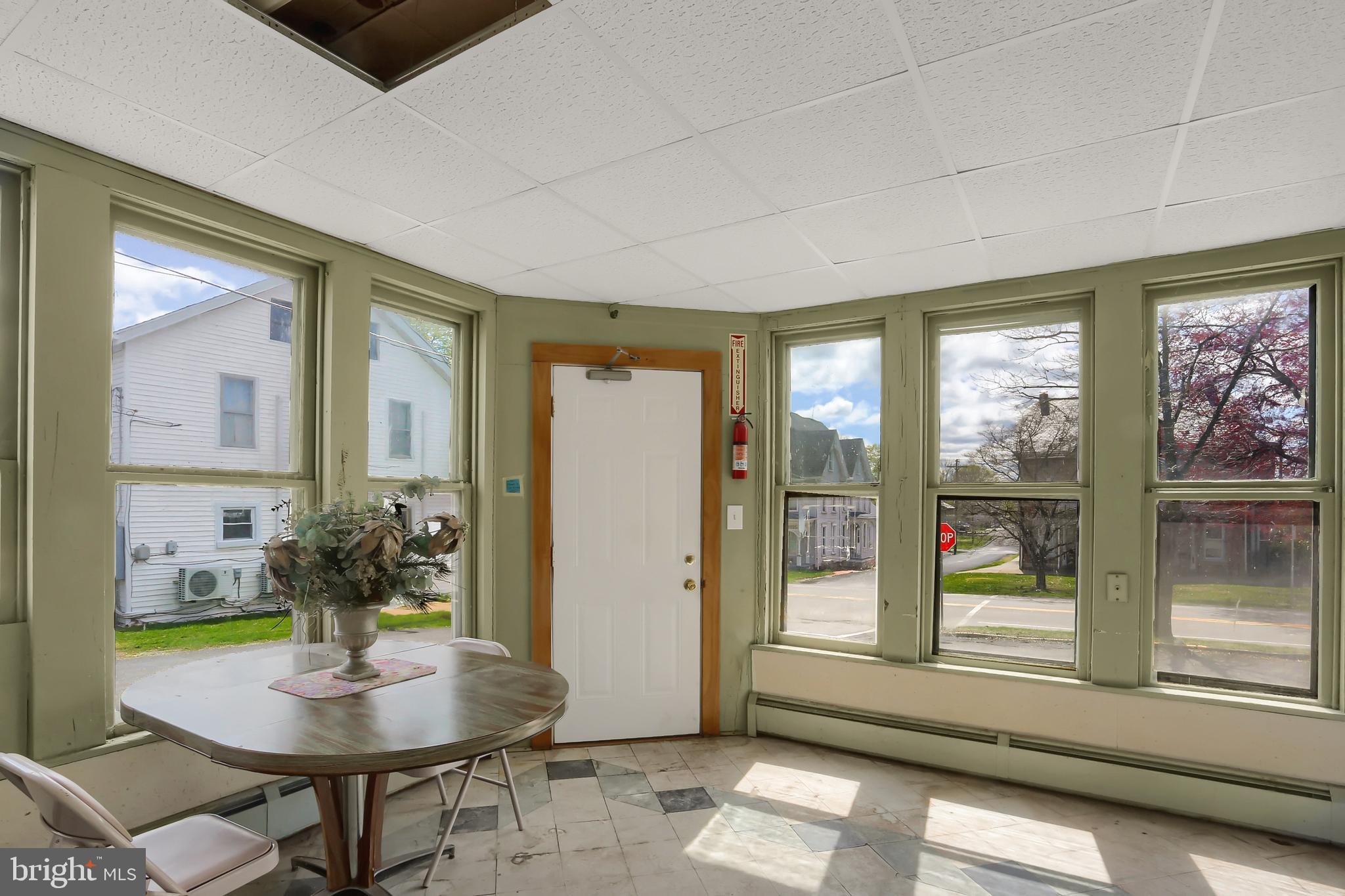 135 East Market Street Berrysburg, PA 17023 - Photo 14 of 45 a living room with furniture and large windows