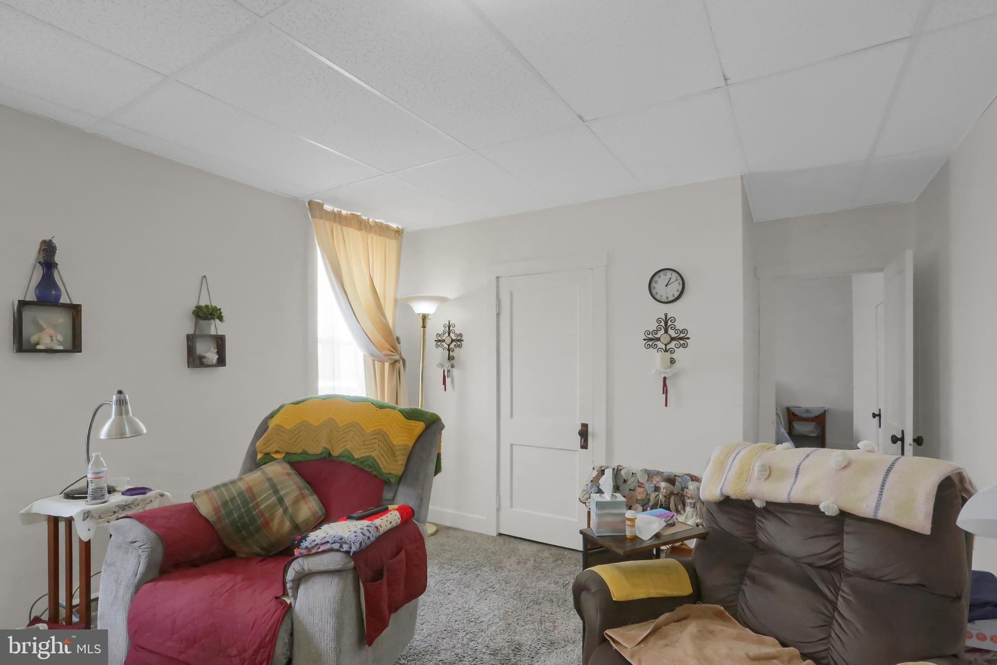 135 East Market Street Berrysburg, PA 17023 - Photo 17 of 45 a living room with furniture and a window