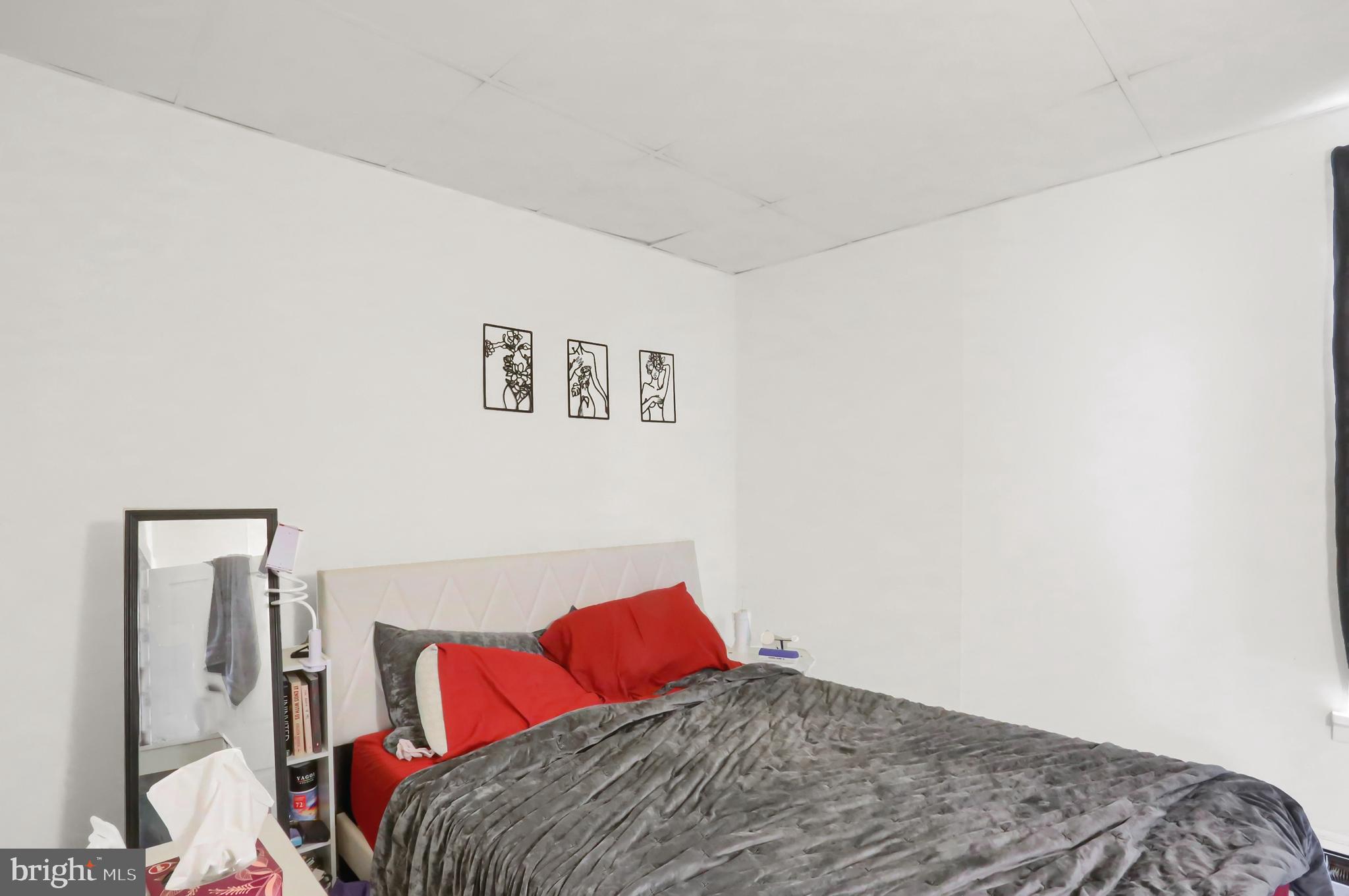 135 East Market Street Berrysburg, PA 17023 - Photo 22 of 45 a bedroom with a bed and a painting on the wall