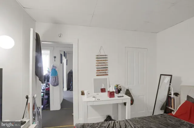 a bathroom with a toilet and a shower curtain