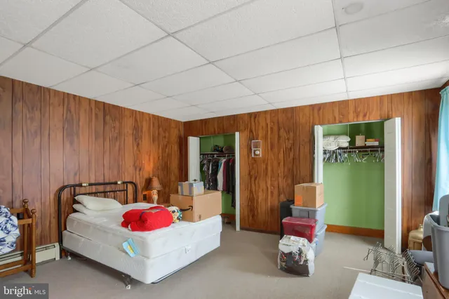 a bathroom with a toilet a sink and a mirror