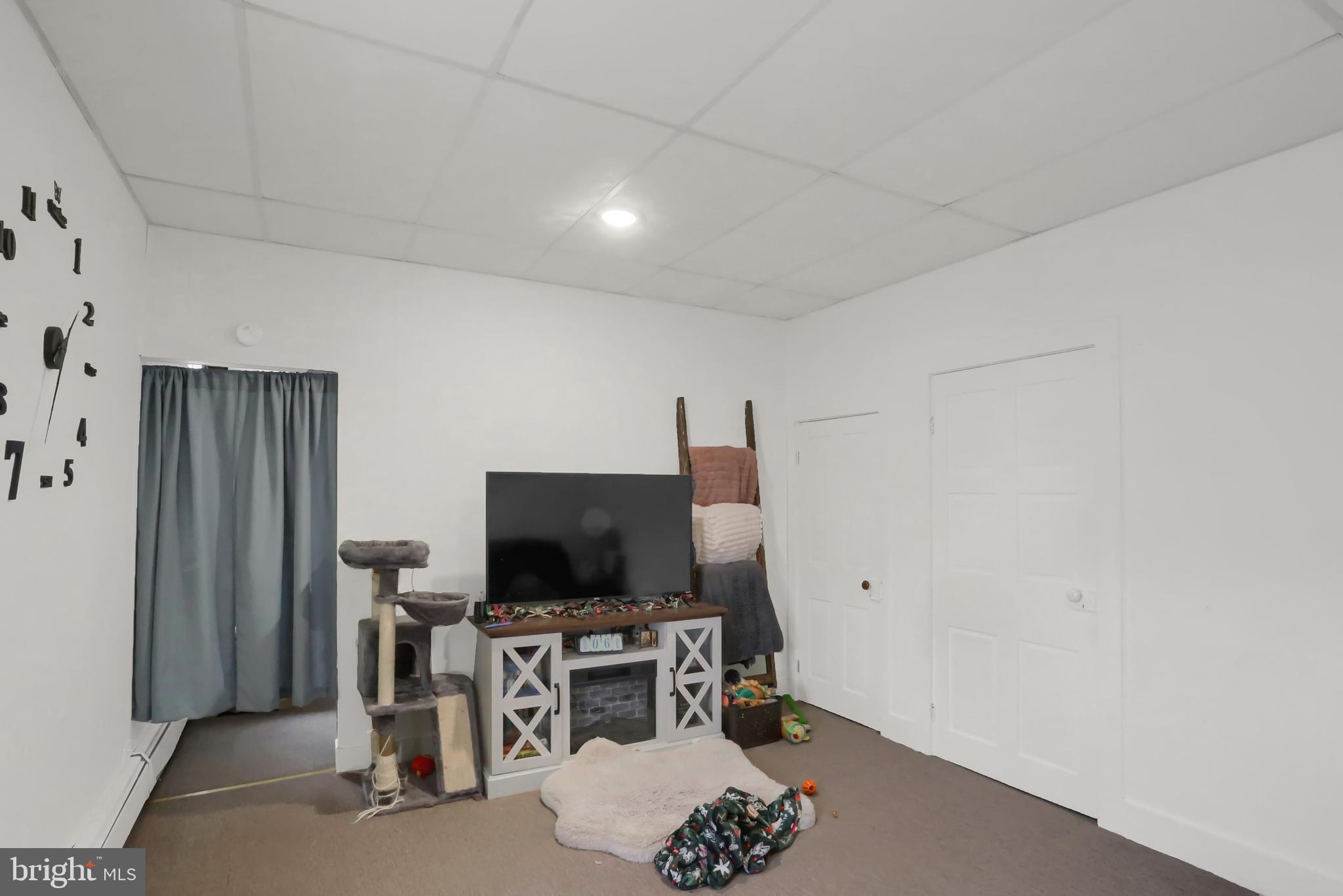 135 East Market Street Berrysburg, PA 17023 - Photo 38 of 45 a living room with furniture and a flat screen tv