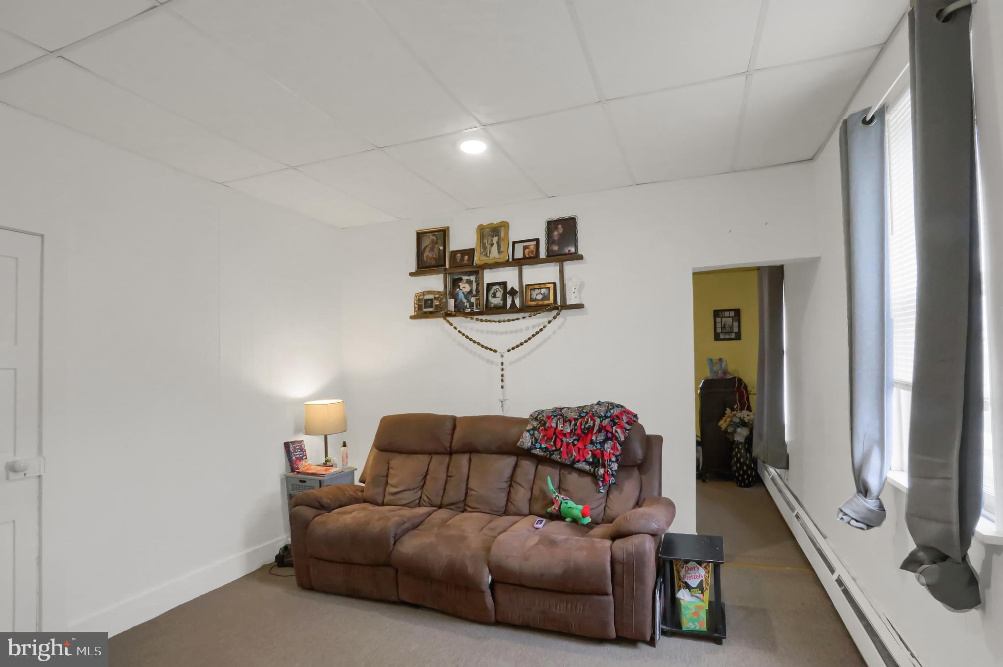 135 East Market Street Berrysburg, PA 17023 - Photo 39 of 45 a living room with furniture and a flat screen tv