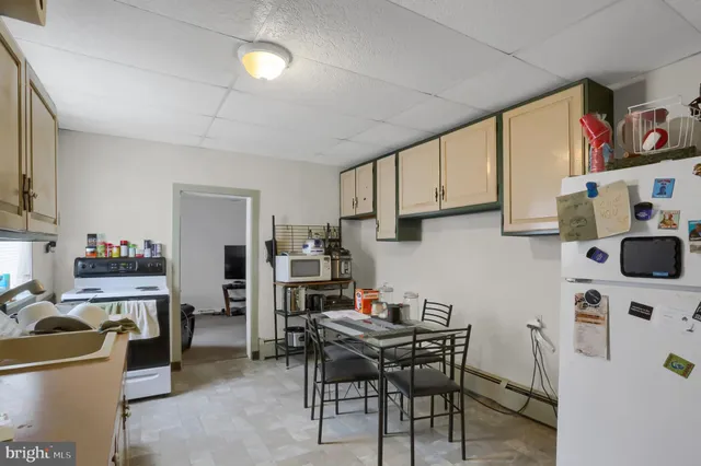 a bedroom with a bed and a tv