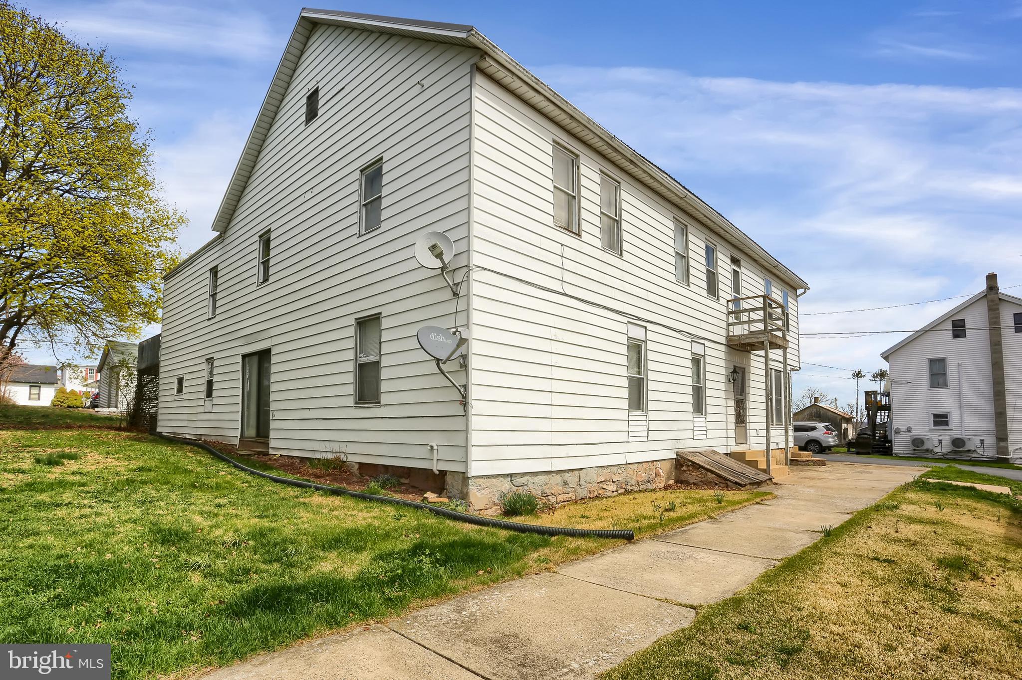 135 East Market Street Berrysburg, PA 17023 - Photo 4 of 45 a view of a house with a backyard