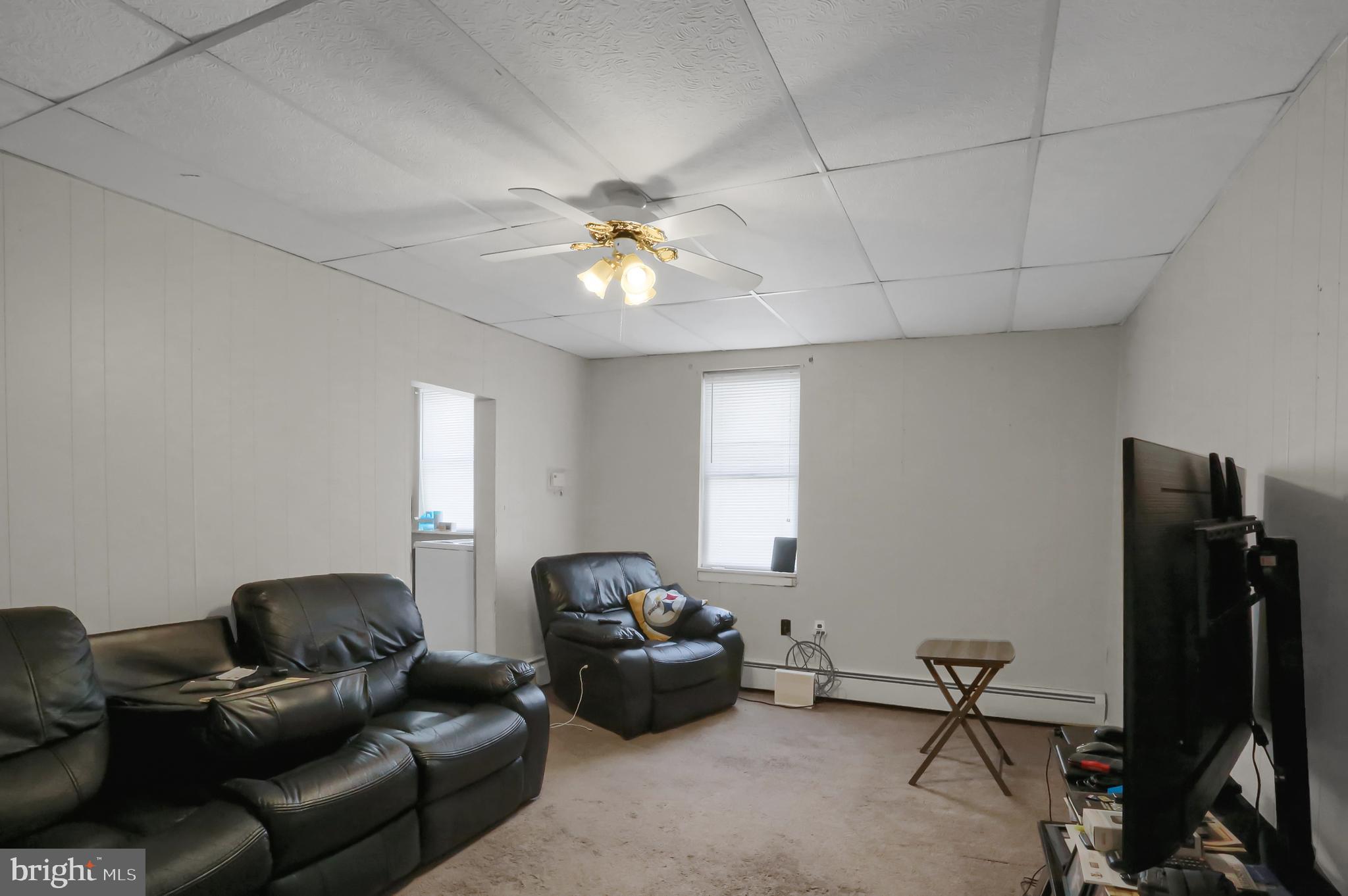 135 East Market Street Berrysburg, PA 17023 - Photo 41 of 45 a living room with furniture and a ceiling fan
