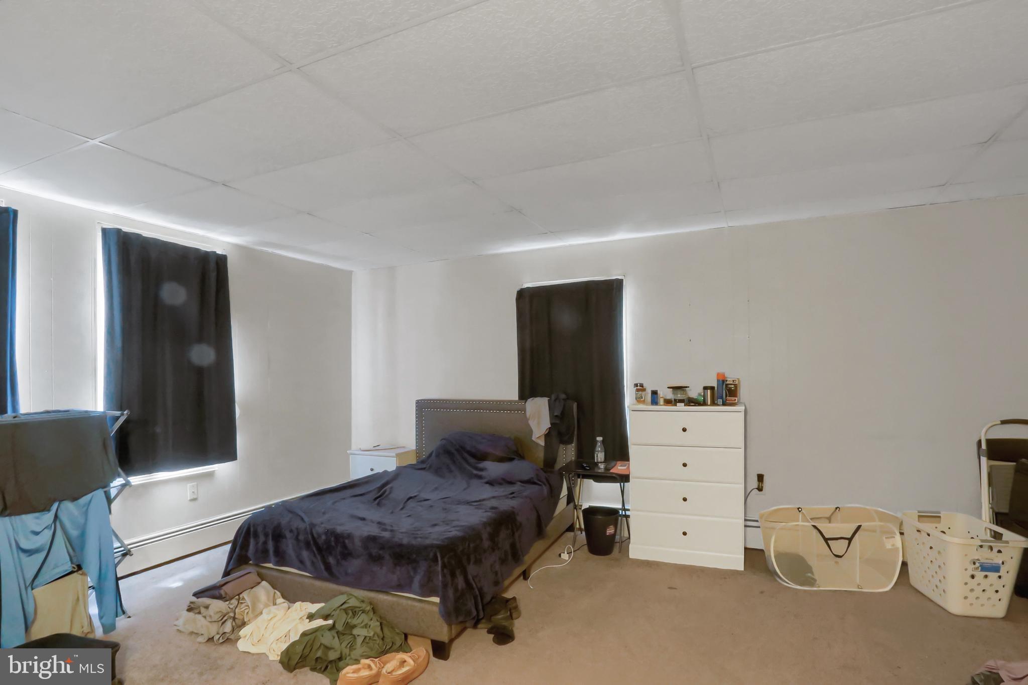 135 East Market Street Berrysburg, PA 17023 - Photo 42 of 45 a living room with furniture and a flat screen tv