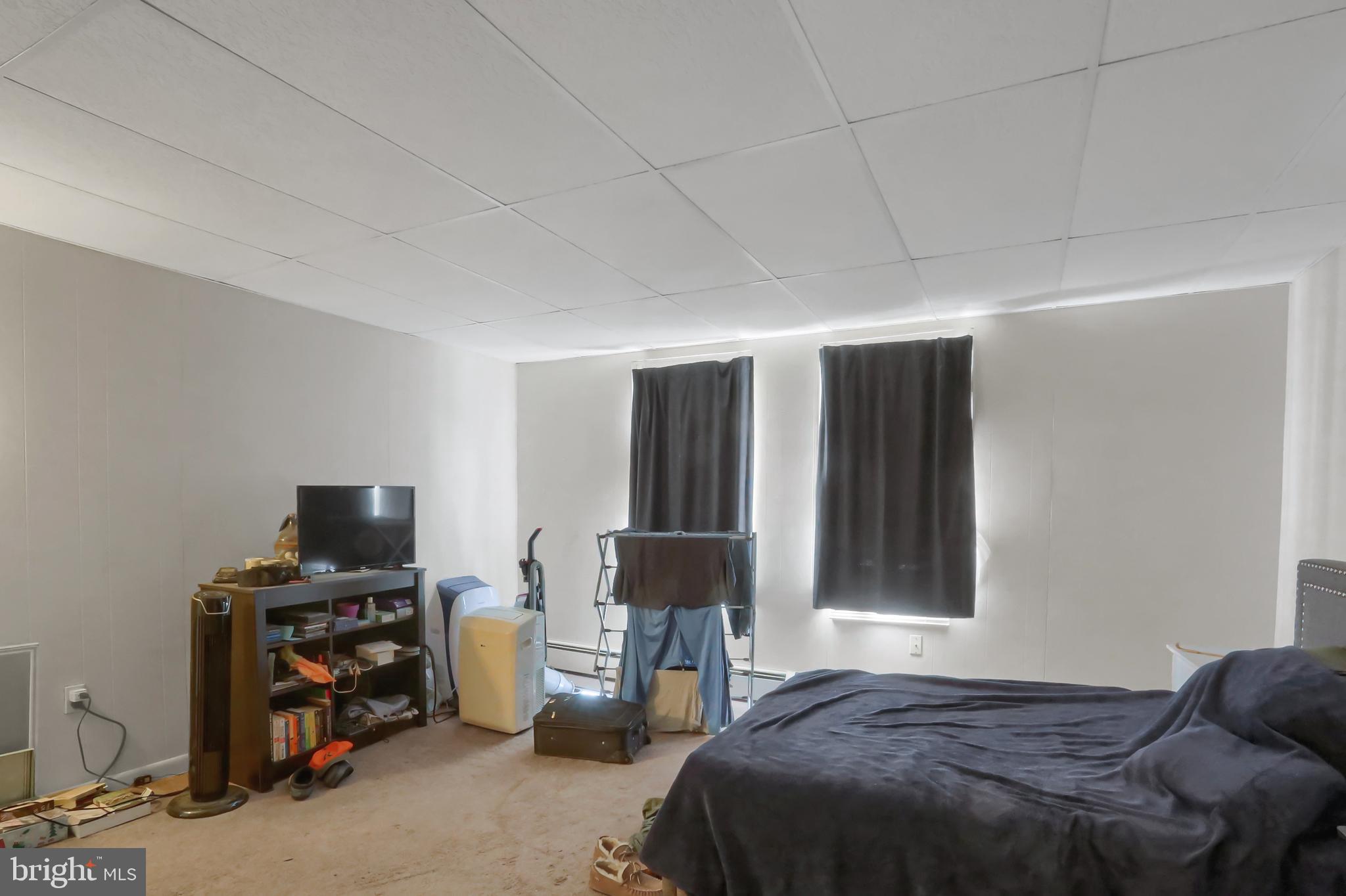 135 East Market Street Berrysburg, PA 17023 - Photo 43 of 45 a bedroom with a bed and a tv