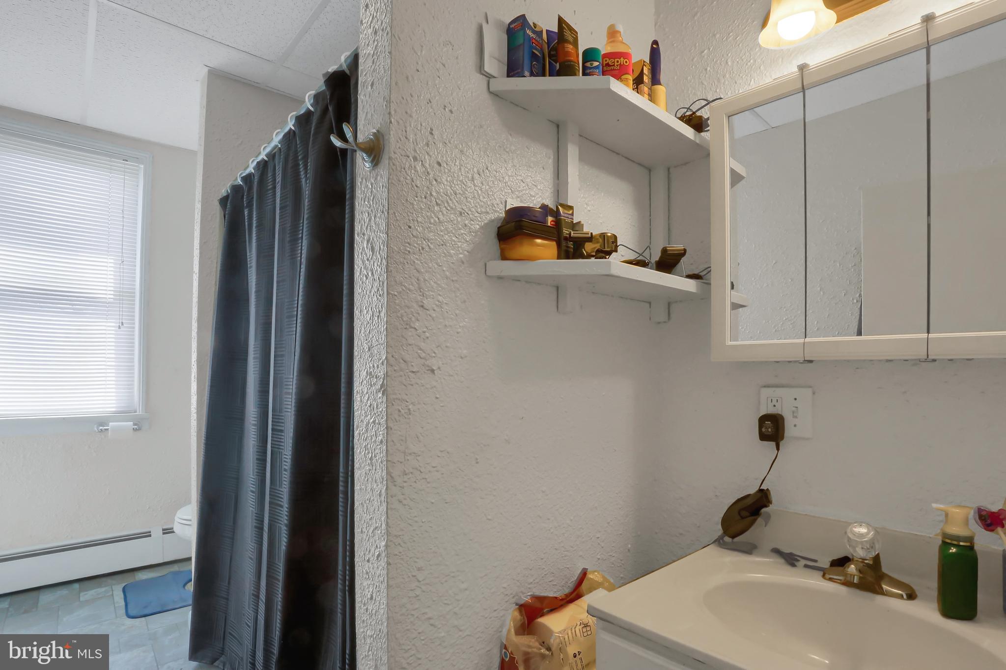135 East Market Street Berrysburg, PA 17023 - Photo 44 of 45 a bathroom with a sink and a toilet