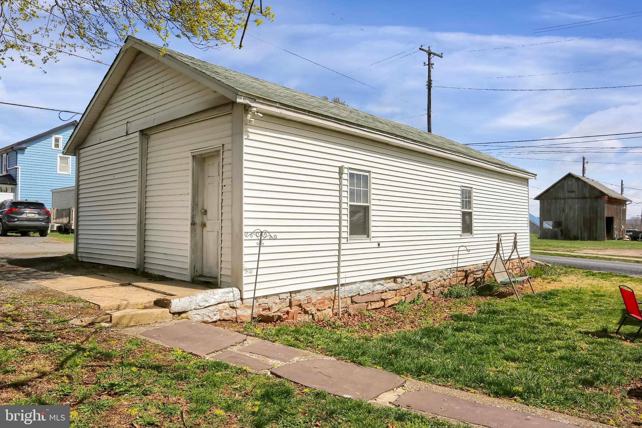 135 East Market Street Berrysburg, PA 17023 - Photo 8 of 45 a front view of a house with a yard