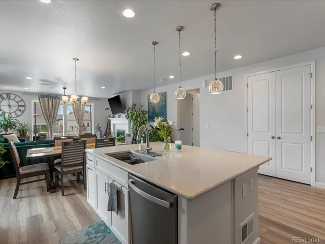a kitchen with a table and chairs in it