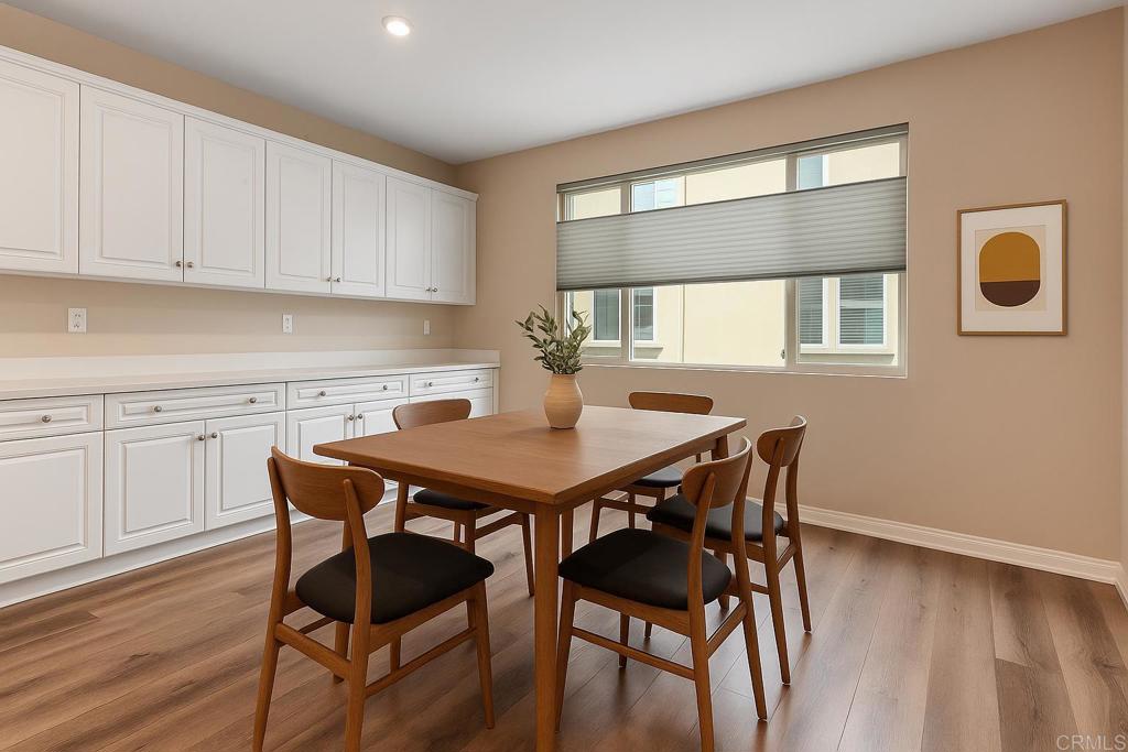 1771 Laurelwood Way Oceanside, CA 92056 - Photo 15 of 46 a view of a dining room with furniture and wooden floor
