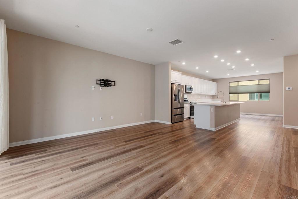 1771 Laurelwood Way Oceanside, CA 92056 - Photo 21 of 46 a view of kitchen with wooden floor and window