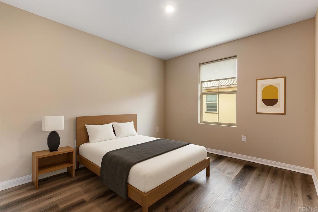 1771 Laurelwood Way Oceanside, CA 92056 - Photo 29 of 46 a bedroom with a bed and wooden floor