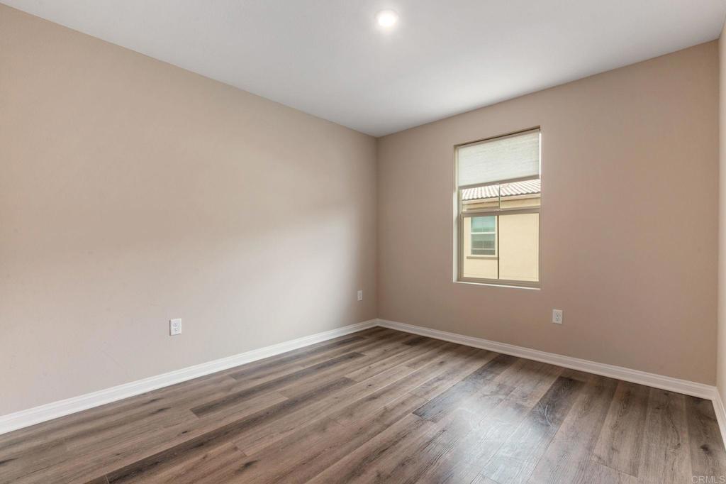 1771 Laurelwood Way Oceanside, CA 92056 - Photo 30 of 46 wooden floor in an empty room with a window