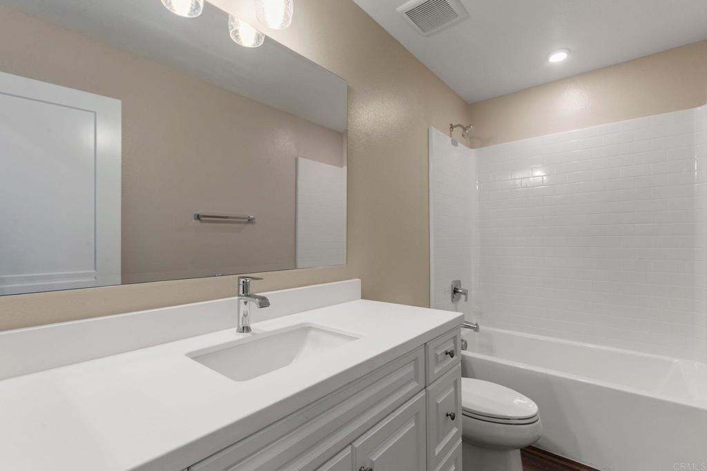 1771 Laurelwood Way Oceanside, CA 92056 - Photo 31 of 46 a bathroom with a sink toilet vanity and shower