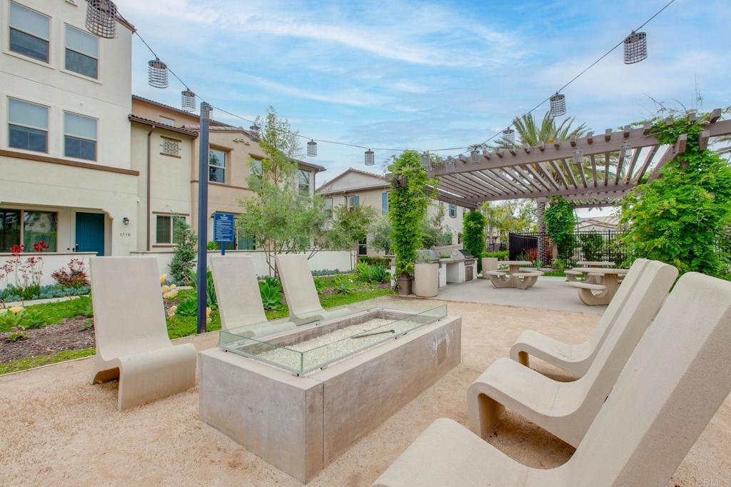 1771 Laurelwood Way Oceanside, CA 92056 - Photo 38 of 46 a view of a patio with couches and a fire pit