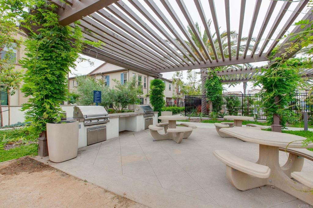 1771 Laurelwood Way Oceanside, CA 92056 - Photo 39 of 46 a view of patio with couches and chairs under an umbrella