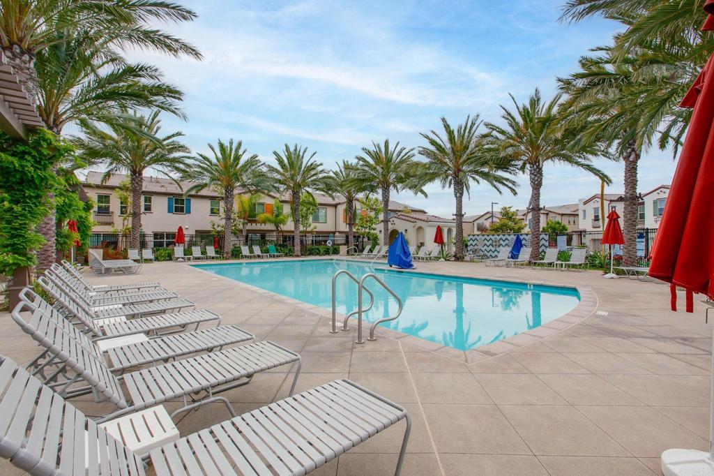 1771 Laurelwood Way Oceanside, CA 92056 - Photo 41 of 46 a row of palm trees and swimming pool in the backyard of a patio