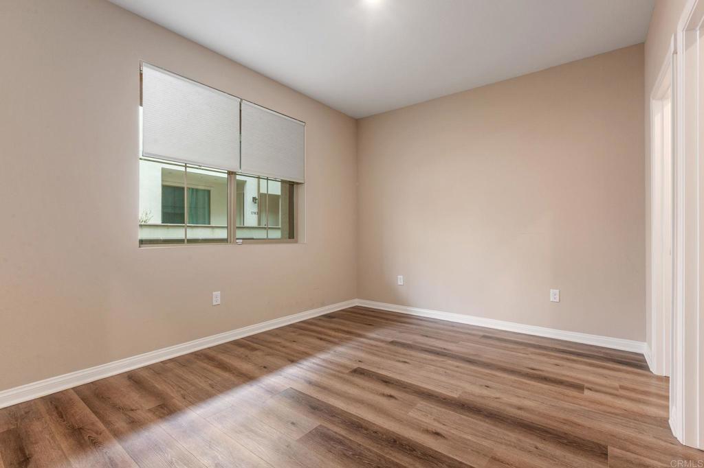 1771 Laurelwood Way Oceanside, CA 92056 - Photo 7 of 46 a view of a room with wooden floor and a window