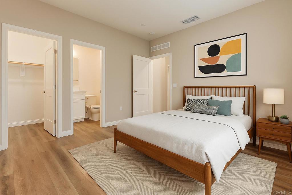 1771 Laurelwood Way Oceanside, CA 92056 - Photo 8 of 46 a spacious bedroom with a bed and a painting on the wall