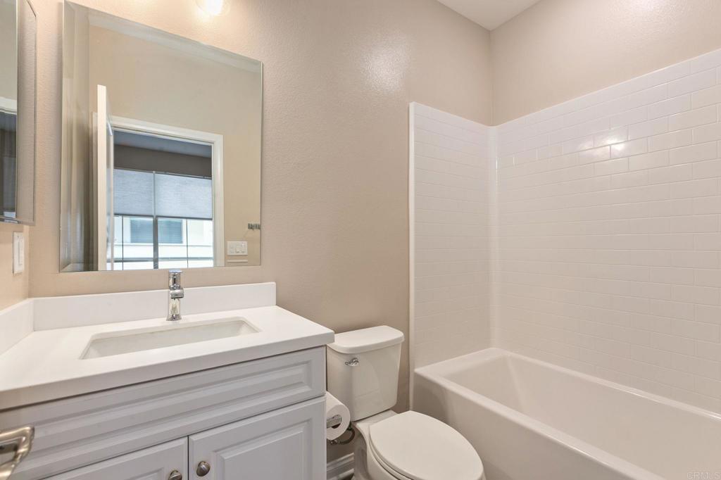 1771 Laurelwood Way Oceanside, CA 92056 - Photo 10 of 46 a bathroom with a sink toilet and bathtub