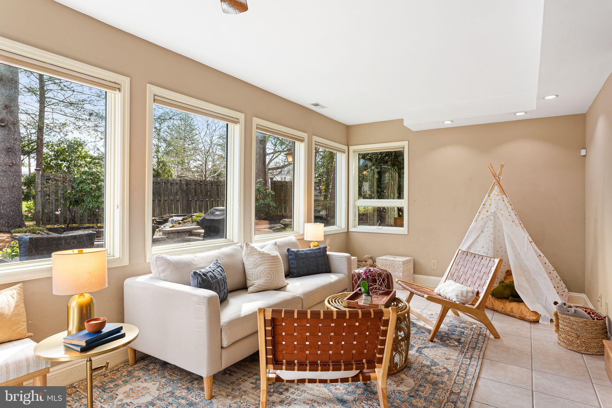 1 Birchall Drive Haddonfield, NJ 08033 - Photo 37 of 45 a living room with furniture and a floor to ceiling window