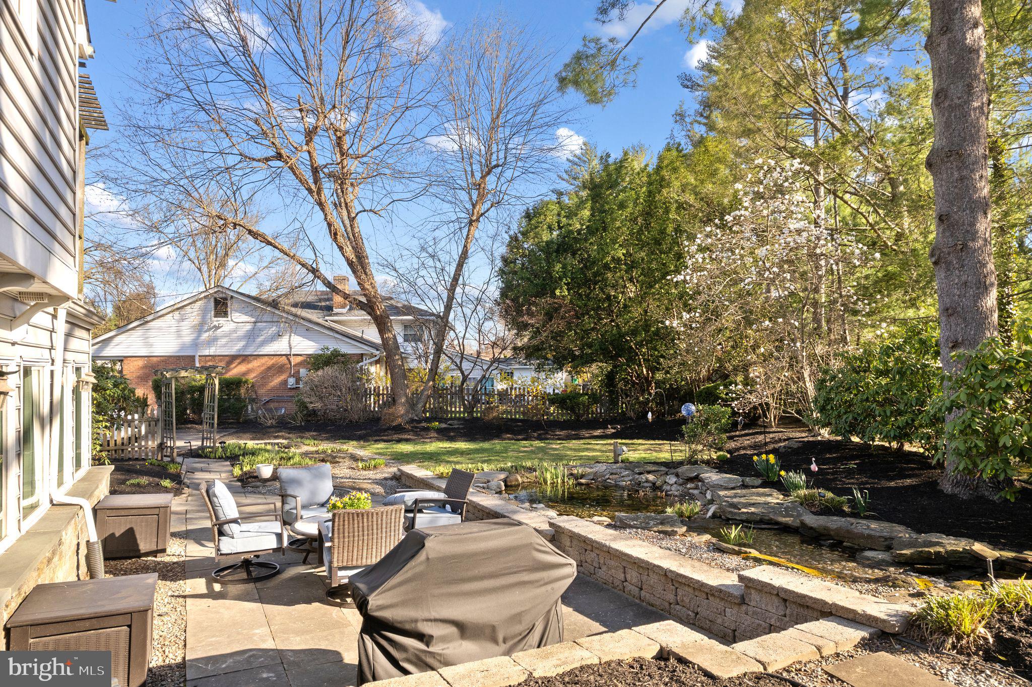 1 Birchall Drive Haddonfield, NJ 08033 - Photo 44 of 45 a view of swimming pool with outdoor seating and trees in the background