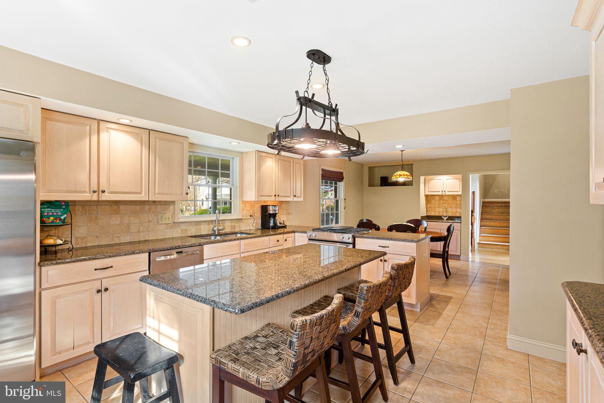 1 Birchall Drive Haddonfield, NJ 08033 - Photo 5 of 45 a large kitchen with a table and chairs in it