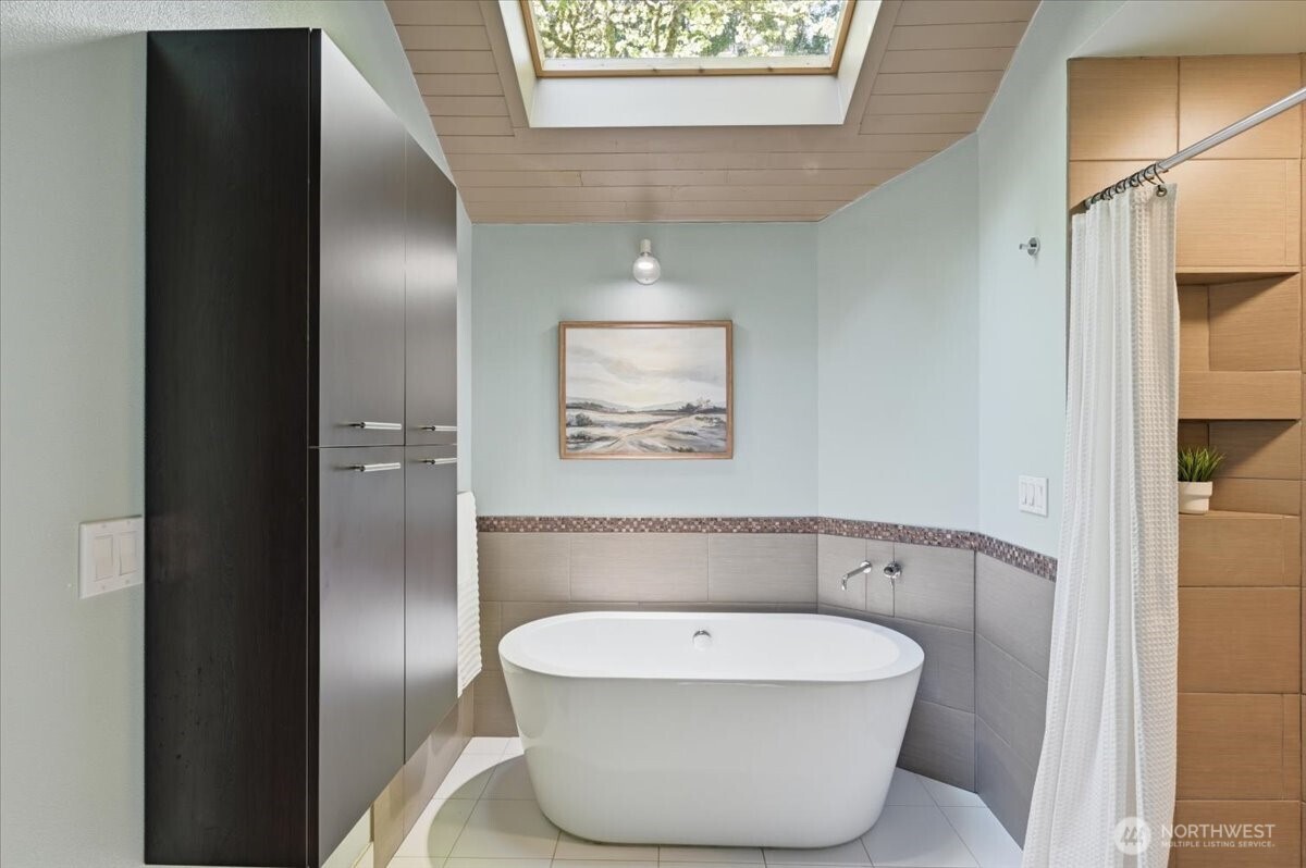 9418 Odin Way Bothell, WA 98011 - Photo 23 of 39 a bathroom with a toilet and a mirror