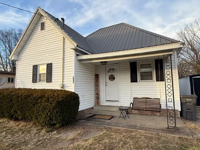 a view of a house with a backyard and a window