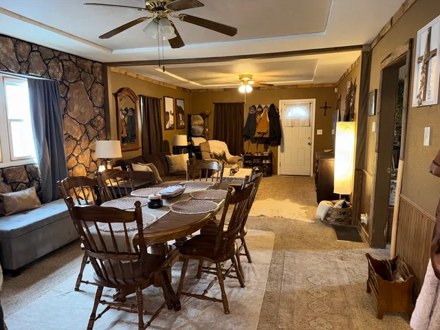 a dining room with furniture and window