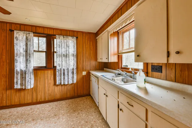a bathroom with a sink and a window