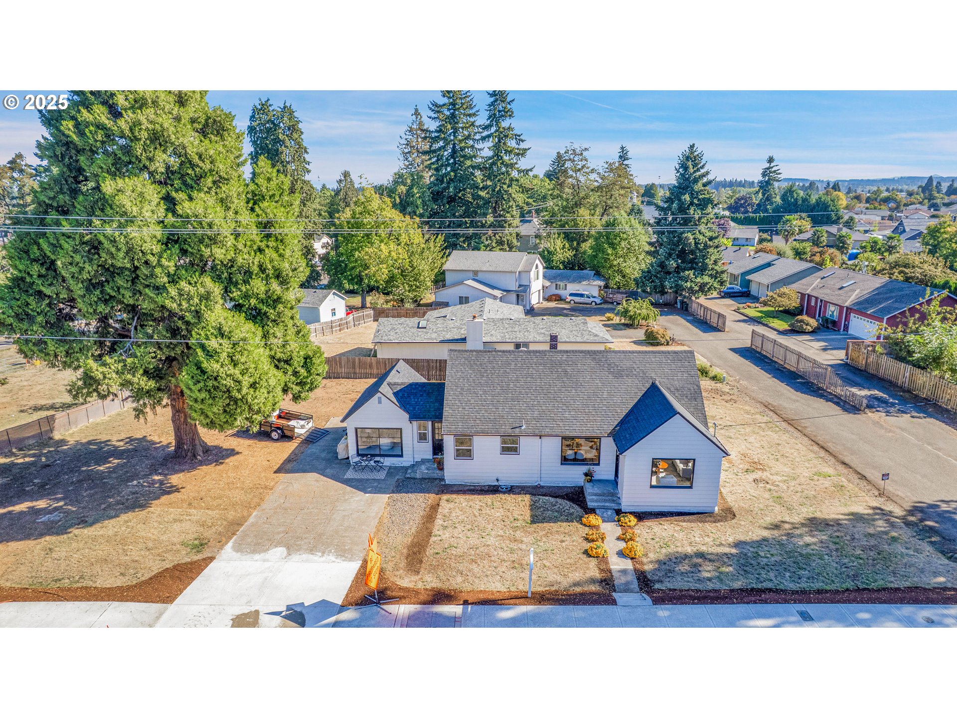 574 South Ivy Street Canby, OR 97013 - Photo 30 of 41 a view of a house with a swimming pool