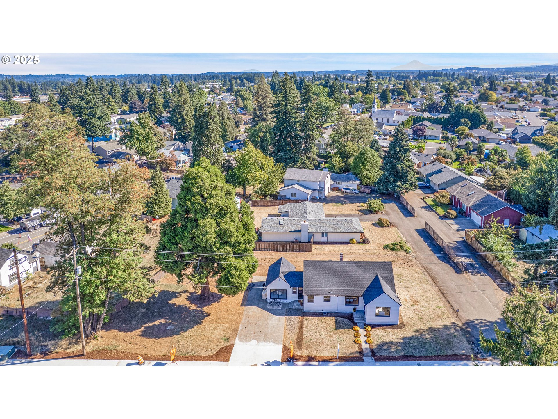 574 South Ivy Street Canby, OR 97013 - Photo 31 of 41 an aerial view of a house with a swimming pool and outdoor space