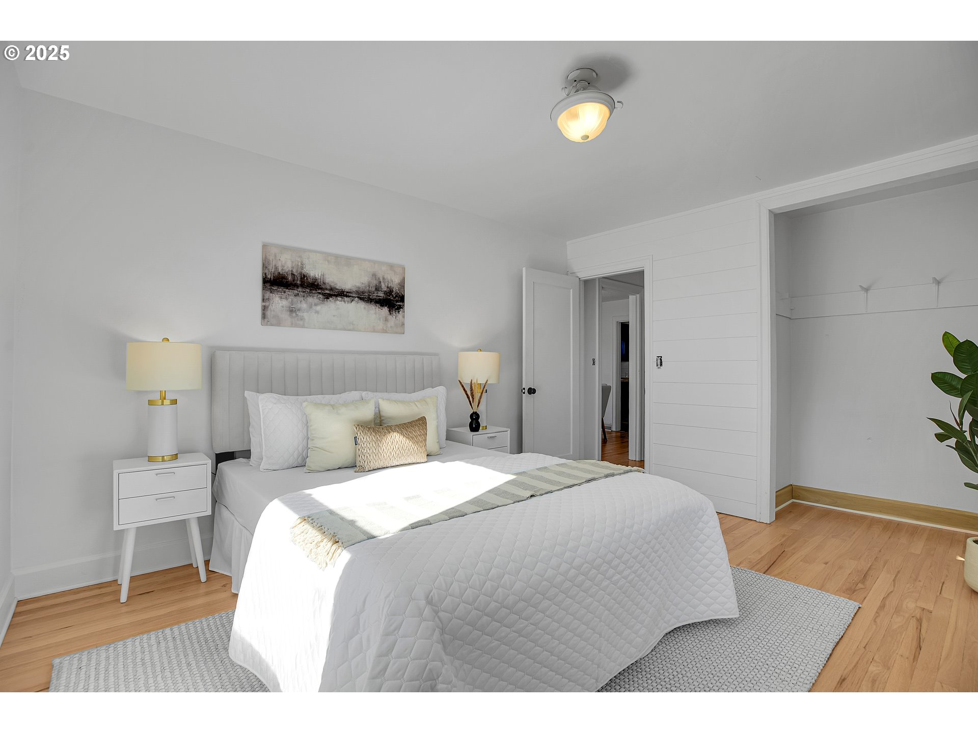 574 South Ivy Street Canby, OR 97013 - Photo 40 of 41 a bedroom with a bed and a lamp