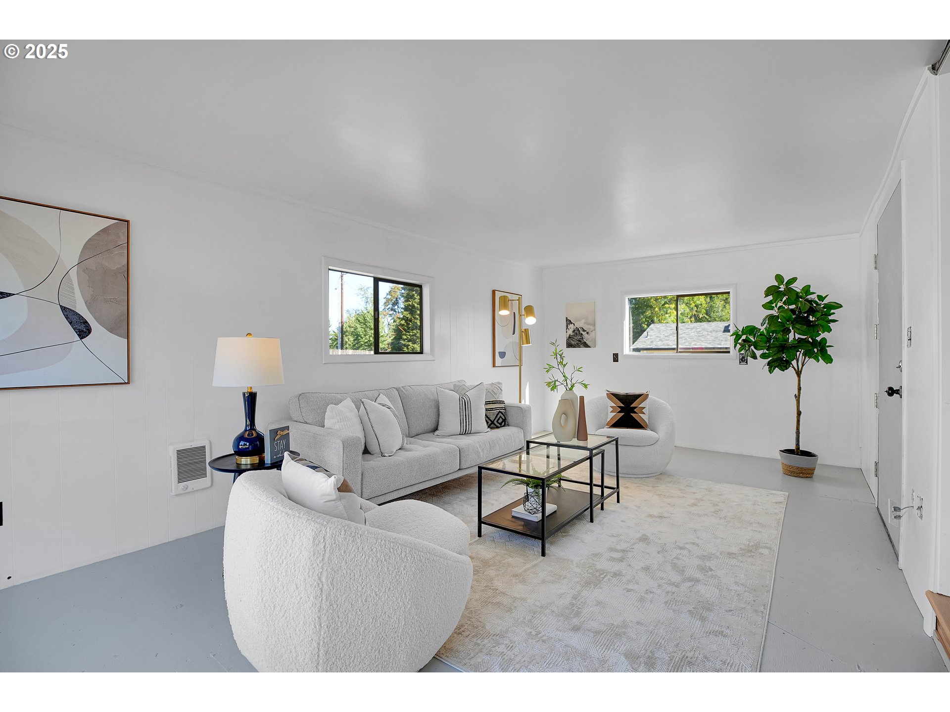 574 South Ivy Street Canby, OR 97013 - Photo 5 of 41 a living room with furniture and a potted plant