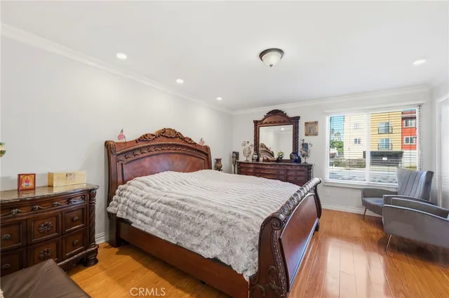 a bed room with a bed and a television