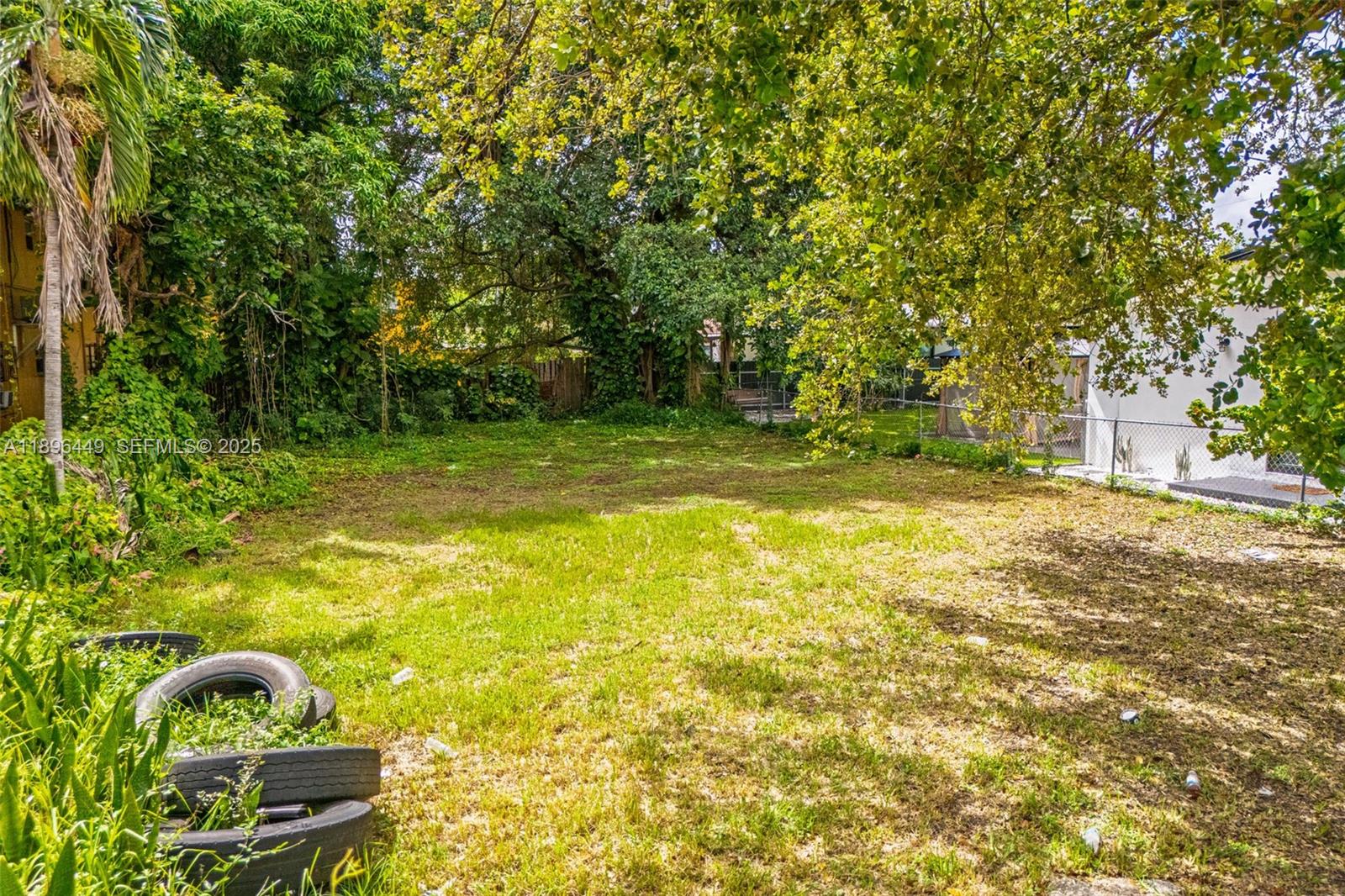 776 Northwest 57th Street Miami, FL 33127 - Photo 5 of 7 a view of a backyard with swimming pool