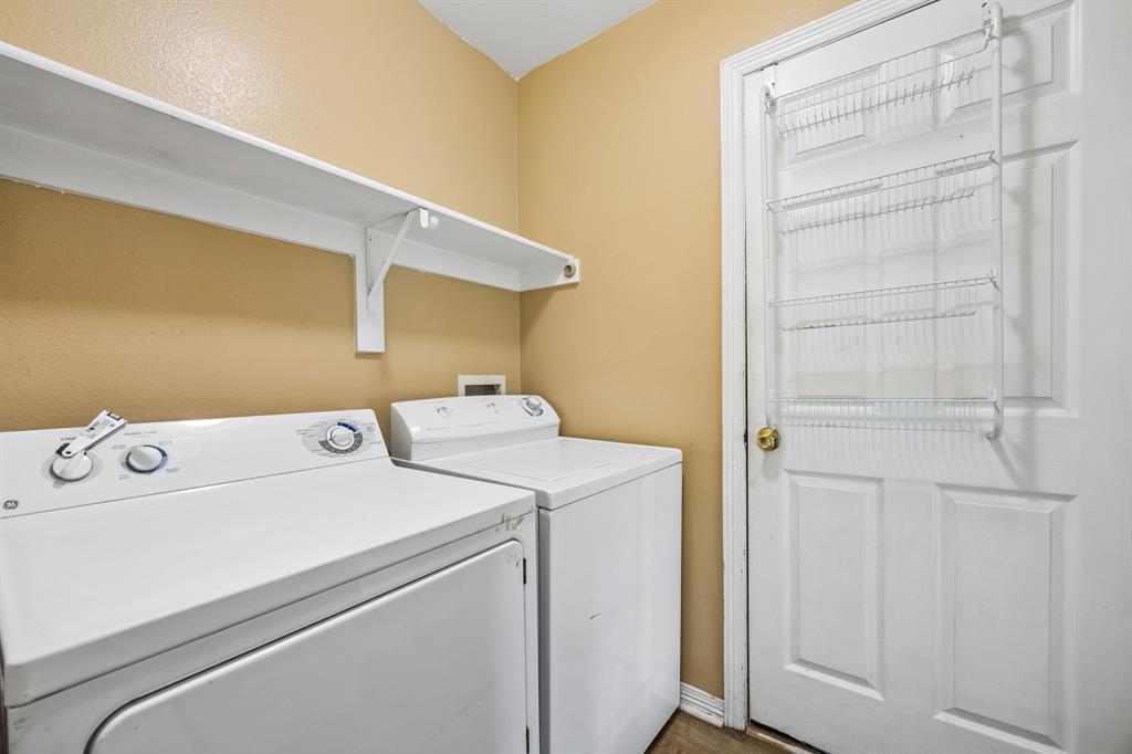 303 Vista Ridge Drive Venus, TX 76084 - Photo 21 of 25 a utility room with dryer and washer