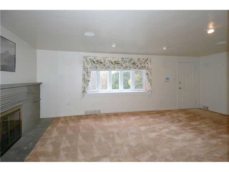 1582 Bellmonte Road Franklin Park, PA 15237 - Photo 3 of 20 Living Room. Spacious living room with a stone fireplace!