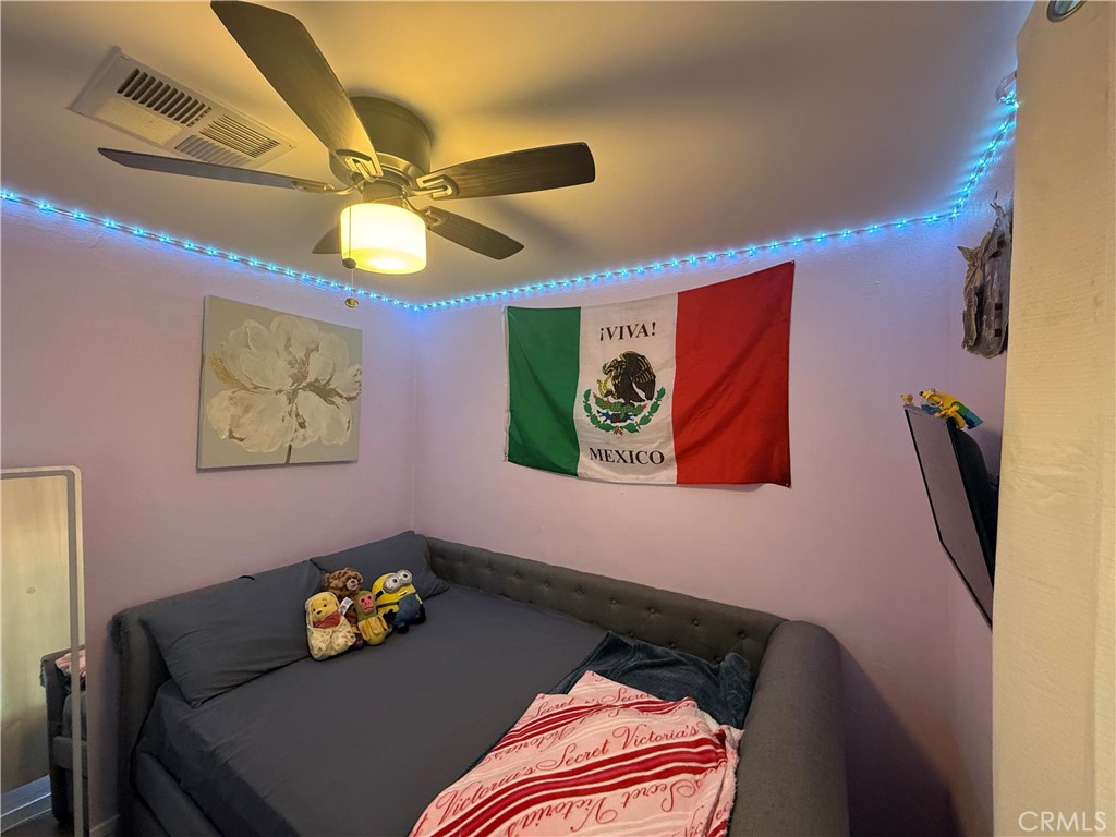 227 Palos Verdes Drive Santa Ana, CA 92704 - Photo 19 of 41 a bedroom with a bed and furniture