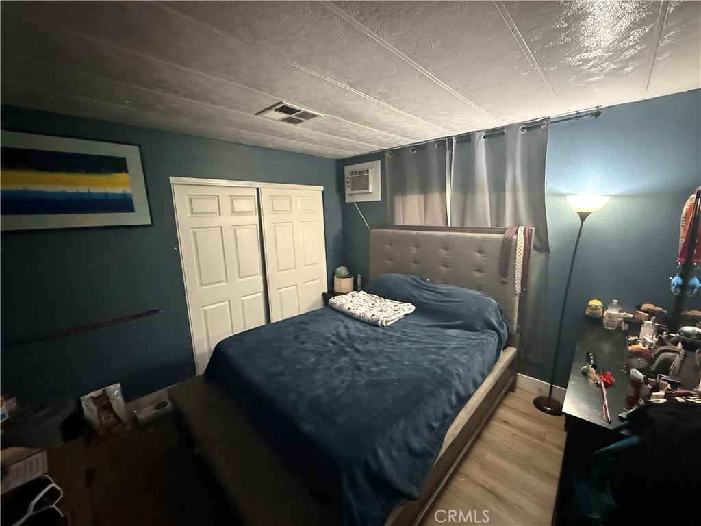 227 Palos Verdes Drive Santa Ana, CA 92704 - Photo 24 of 41 a bedroom with a bed and a window