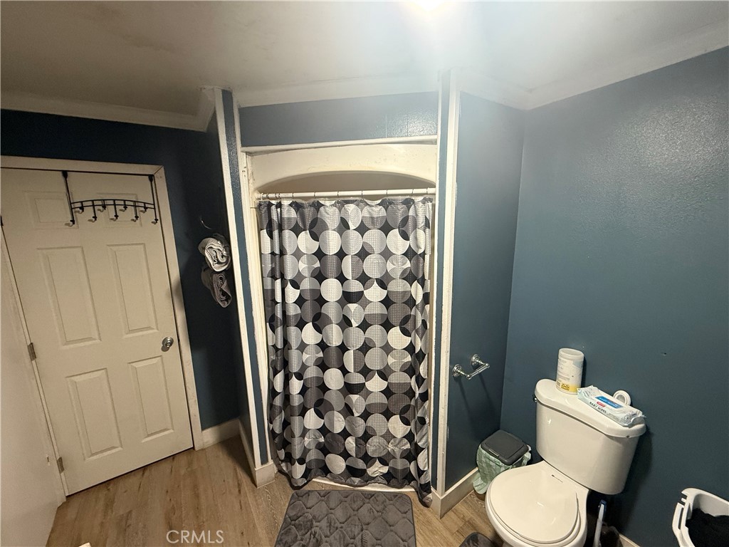 227 Palos Verdes Drive Santa Ana, CA 92704 - Photo 27 of 41 a white toilet sitting next to a bathroom sink